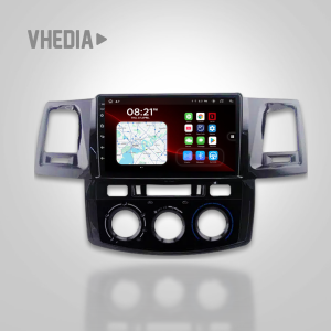 Car dashboard infotainment system with a large touchscreen displaying a map and app icons, mounted in a vehicle center console.