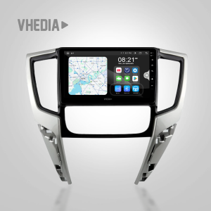 Car dashboard trim with a central touchscreen displaying apps and maps (infotainment system) set against a light grey background with 'VHEDIA' branding.