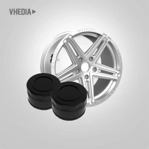 TPMS 13 - VHEDIA Shiny silver alloy car wheel with two black circular rubber pads in front against a gray gradient background.