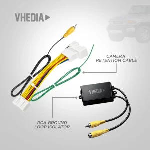 MT-1733-PB-CK_201 - VHEDIA Car camera kit components: a white multi-pin connector with colored wires, a green ground wire, and a black module labeled VHEDIA with yellow RCA plugs