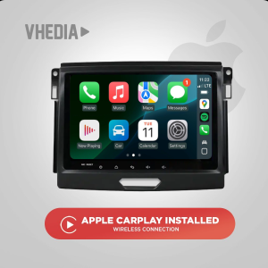 In-car touchscreen head unit showing Apple CarPlay app icons with a promo banner below that says 'Apple CarPlay Installed'.